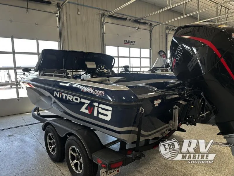 Slide: The Image of 2024 White River ZV19 boat in showroom, featuring Nitro branding and powerful engine. - 6