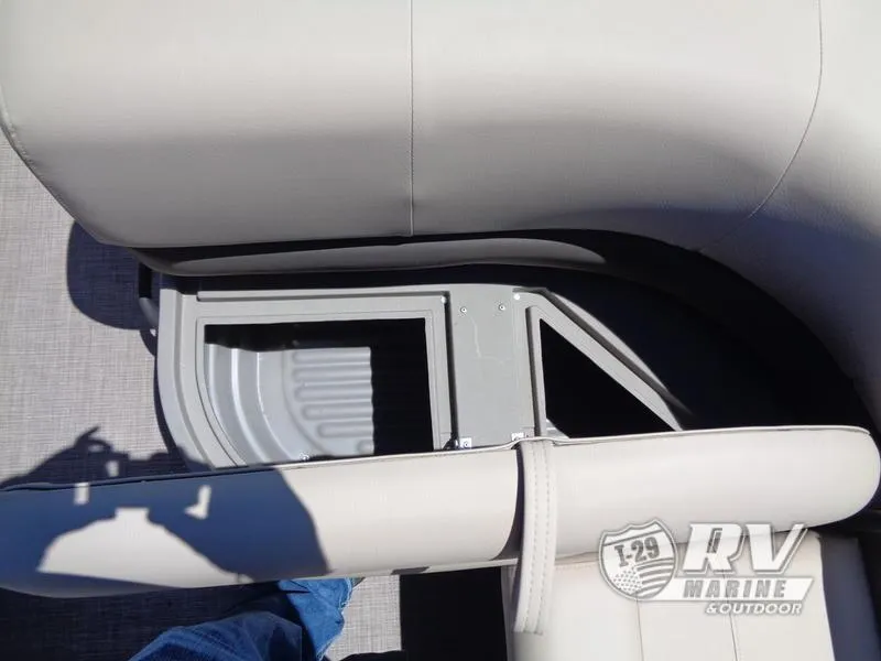 Slide: The Image of 2024 Party Barge 18DLX seating area with storage compartment, gray upholstery. - 10