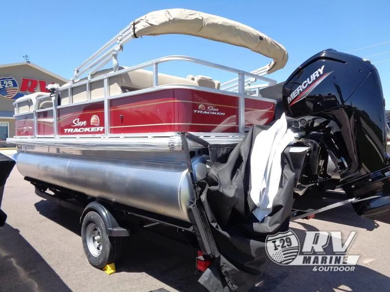 Slide: The Image of 2024 Party Barge 18DLX pontoon boat with Mercury engine, displayed at RV Marine. - 3