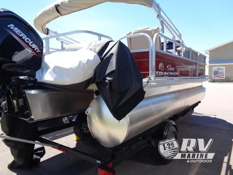 Slide: The Image of 2024 Party Barge 18DLX pontoon boat with Mercury engine on trailer. - 5