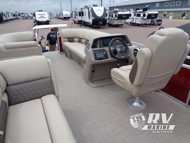 Slide: The Image of 2024 Party Barge 20 pontoon boat with beige seating and modern dashboard. - 21