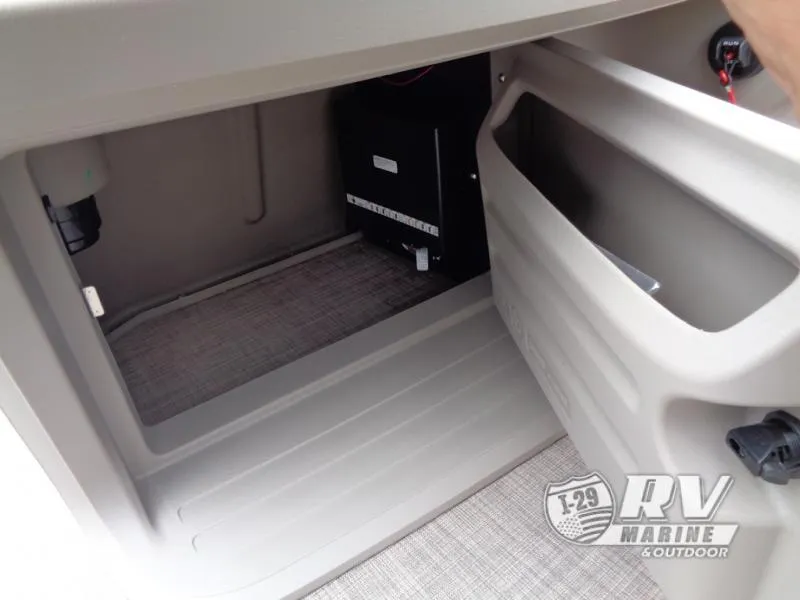 Slide: The Image of 2024 Party Barge 20 storage compartment with electrical components, RV Marine logo visible. - 9