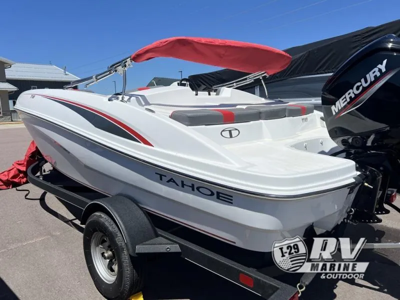 Slide: The Image of 2024 TAH18J Tahoe boat with Mercury engine on trailer, red canopy, outdoor setting. - 3