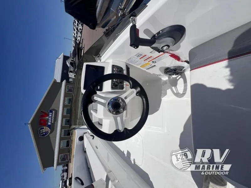 Slide: The Image of 2024 T18MOK TAH18J boat interior with steering wheel at RV Marine dealership. - 4
