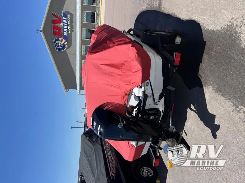 Slide: The Image of 2024 T18MOK TAH18J boat with red cover at RV Marine dealership. - 6