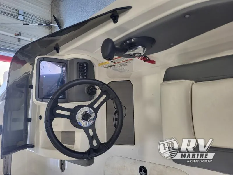 Slide: The Image of 2024 T21 Tahoe boat dashboard with steering wheel and control panel. - 5