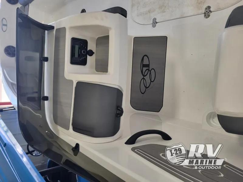 Slide: The Image of 2024 Tahoe T21 boat interior with control panel and storage compartments. - 6