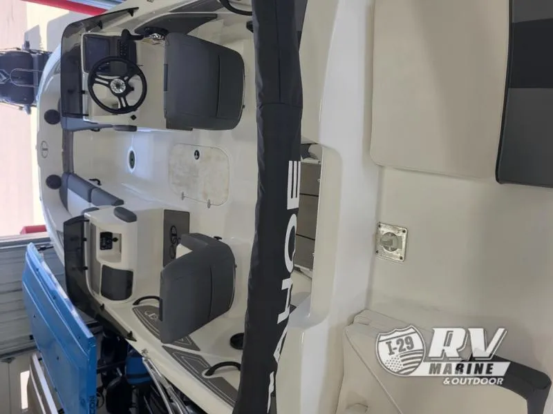Slide: The Image of 2024 T21 Tahoe boat interior with steering wheel and seating, displayed at RV Marine & Outdoor. - 9