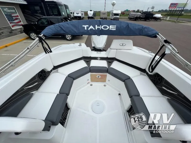 Slide: The Image of 2024 Tahoe 210S boat interior with seating and canopy, displayed at RV Marine dealership. - 10
