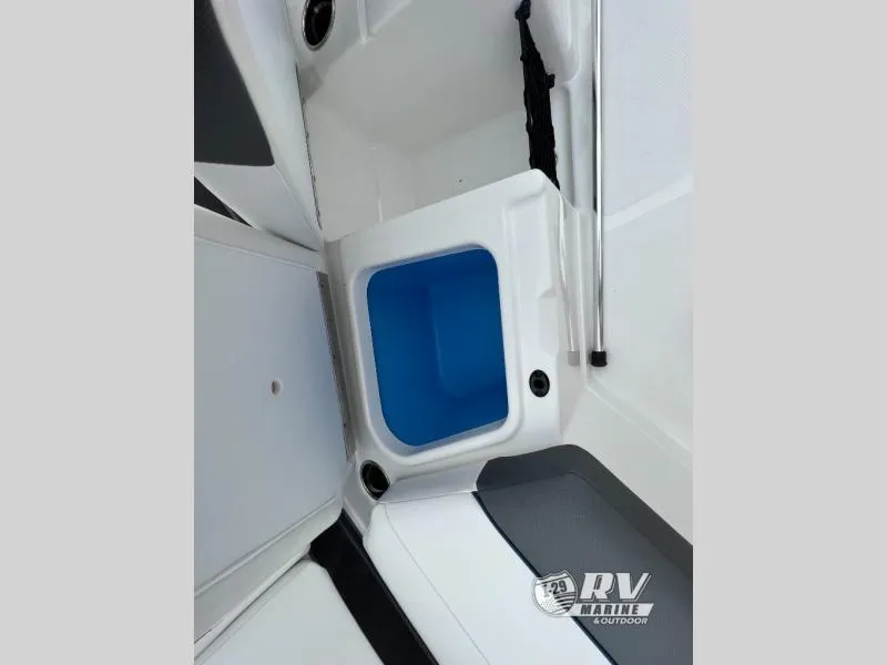 Slide: The Image of 2024 Tahoe 210S boat interior with storage compartment and seating area. - 12