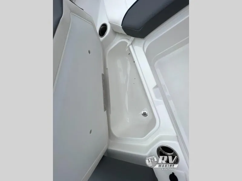 Slide: The Image of 2024 Tahoe 210S boat interior storage compartment with cup holders. - 13