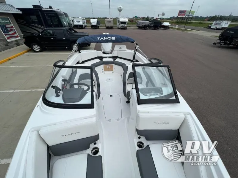 Slide: The Image of 2024 Tahoe 210S boat at RV Marine dealership, featuring sleek design and spacious seating. - 17
