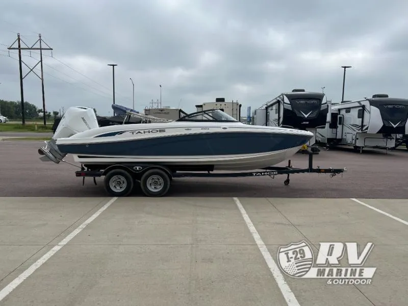 Slide: The Image of 2024 Tahoe 210S boat on trailer at RV Marine dealership. - 2