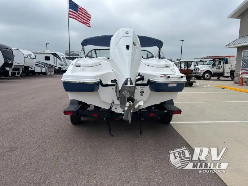 Slide: The Image of 2024 Tahoe 210S boat on trailer at RV Marine dealership. - 4