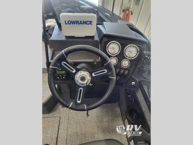 Slide: The Image of 2024 Targa V19 boat dashboard with steering wheel and Lowrance navigation system. - 5