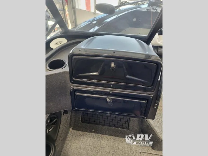 Slide: The Image of 2024 Targa V19 dashboard with storage compartments in a boat interior. - 6