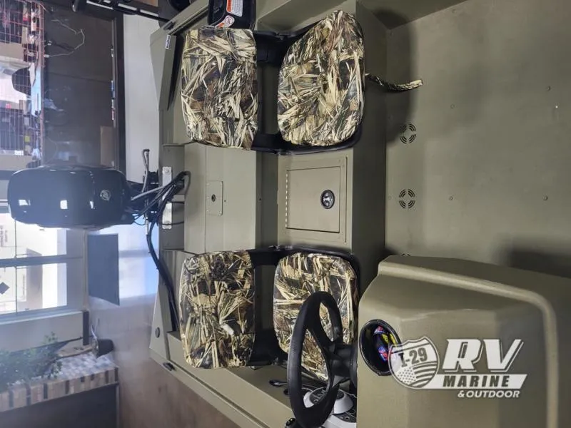 Slide: The Image of 2024 Tracker 1754SC boat interior with camo seats and steering wheel. - 5