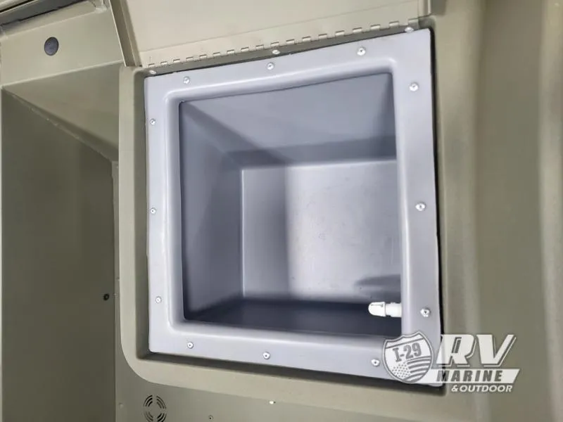 Slide: The Image of 2024 Tracker 1754SC boat storage compartment, gray interior, RV Marine logo visible. - 6