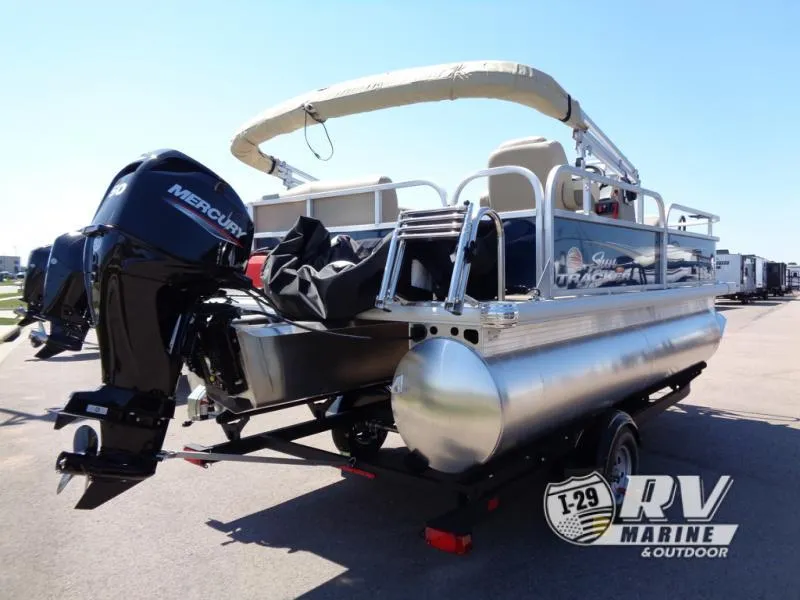 Slide: The Image of 2025 BASS BUGGY 16 XL Select pontoon boat with Mercury engine, parked outdoors. - 12