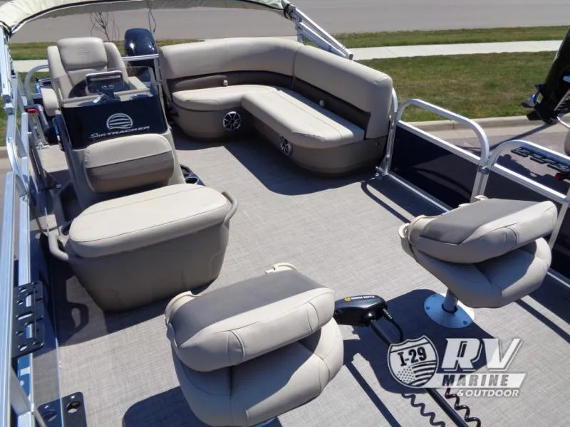 Slide: The Image of 2025 BASS BUGGY 16 XL Select pontoon boat interior with beige seating and steering console. - 13