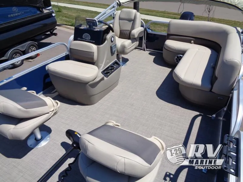 Slide: The Image of 2025 BASS BUGGY 16 XL Select pontoon boat interior with beige seating and steering console. - 14