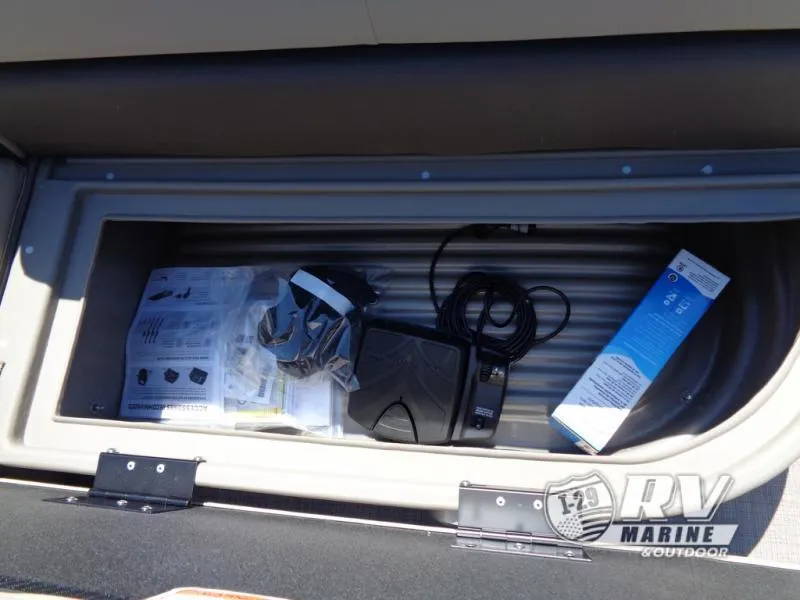 Slide: The Image of Storage compartment of 2025 BASS BUGGY 16 XL Select with accessories and manuals. - 7