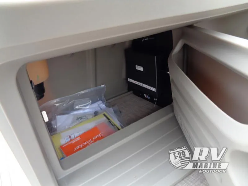 Slide: The Image of Storage compartment of 2025 Party Barge PB22XP3 with manuals and equipment. - 11