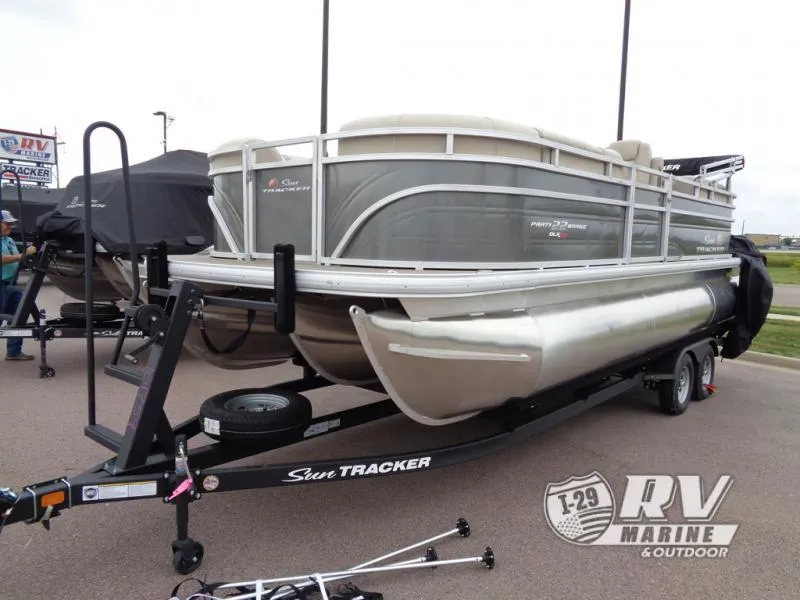 Slide: The Image of 2025 Party Barge PB22XP3 pontoon boat on trailer at RV Marine dealership. - 12