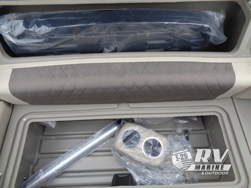 Slide: The Image of 2025 Party Barge PB22XP3 storage compartment with cup holders and accessories. - 16