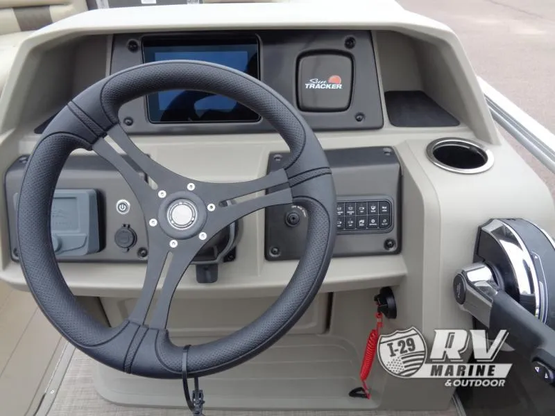 Slide: The Image of 2025 Party Barge PB22XP3 steering console with controls and display. - 25