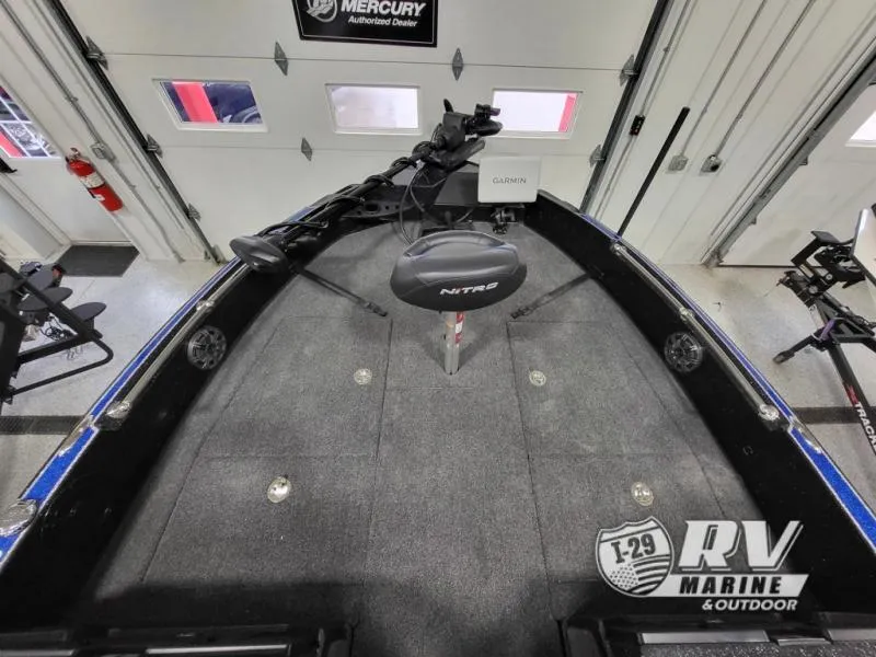 Slide: The Image of 2025 Nitro ZV21 boat interior with Garmin equipment in a showroom. - 13