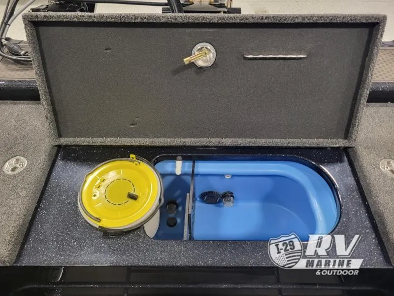 Slide: The Image of Nitro ZV21 2025 boat storage compartment with blue interior and yellow lid. - 8