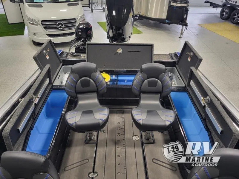 Slide: The Image of 2025 Nitro ZV21 boat interior with seating and storage compartments in showroom. - 9