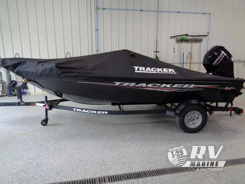 Slide: The Image of 2025 SUPER GUIDE SG16 boat with cover on trailer in garage. - 16