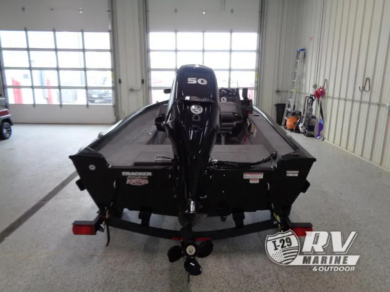 Slide: The Image of 2025 SUPER GUIDE SG16 boat with 50HP motor in a garage. - 7