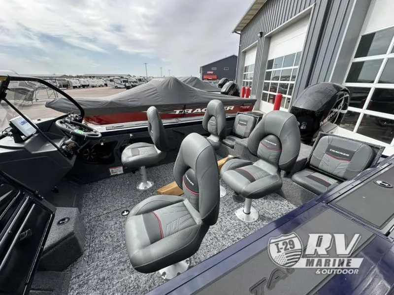 Slide: The Image of 2025 Targa 18 boat interior with multiple gray seats at RV Marine dealership. - 16