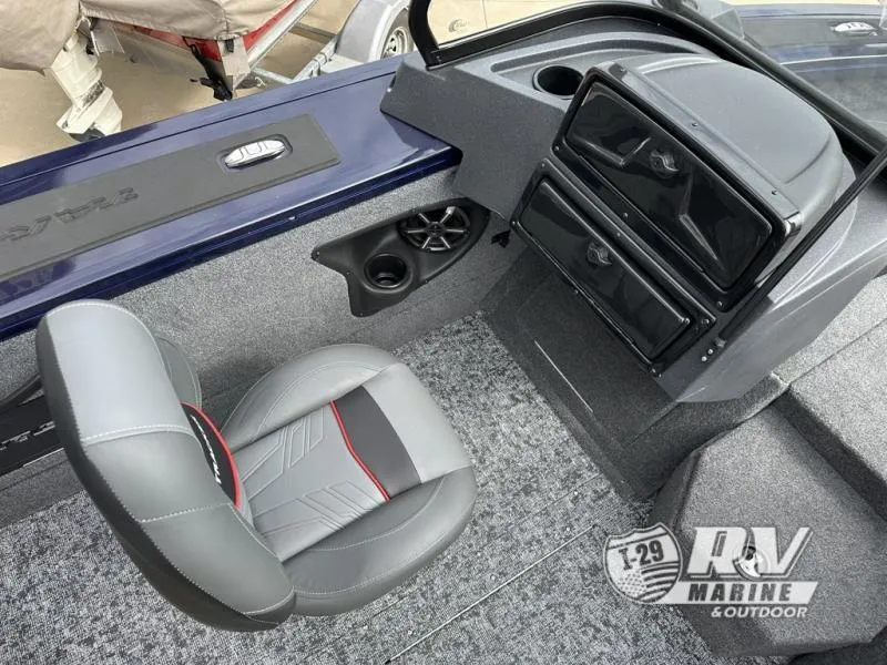 Slide: The Image of 2025 Targa 18 boat interior with gray seat and dashboard, featuring RV Marine logo. - 5