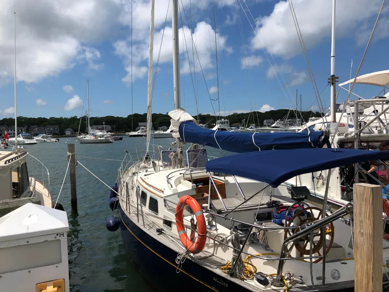 The Image of 1984 Belliure Sloop docked at a marina under a clear blue sky. - 0