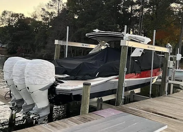 Slide: The Image of 2017 Sea Ray 350 SLX boat docked with covered engines. - 35
