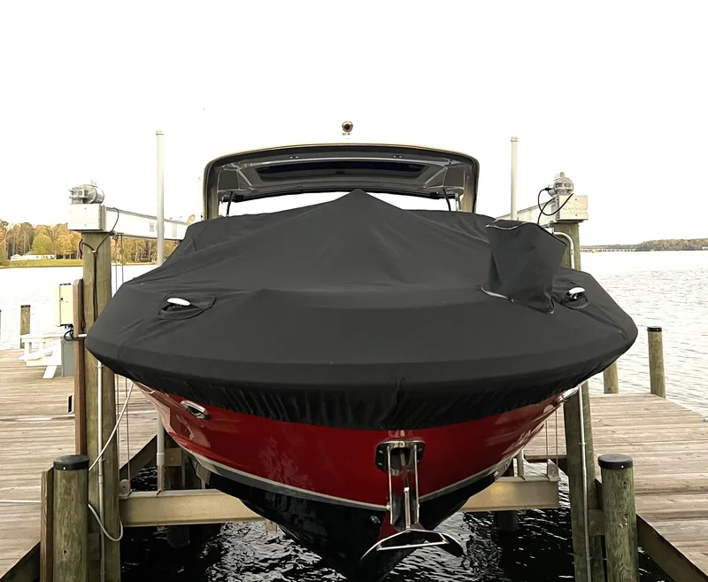 Slide: The Image of 2017 Sea Ray 350 SLX boat with cover on dock. - 36
