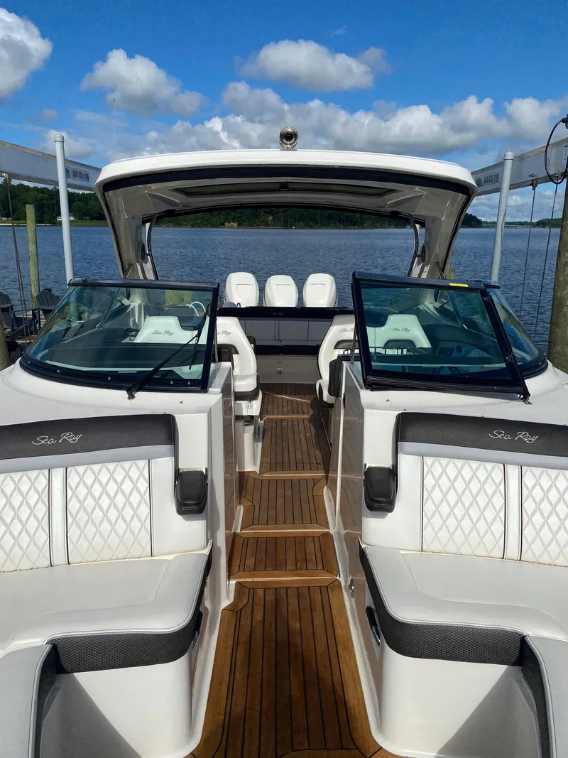 Slide: The Image of 2017 Sea Ray 350 SLX luxury boat with spacious seating and elegant design on a sunny day. - 9