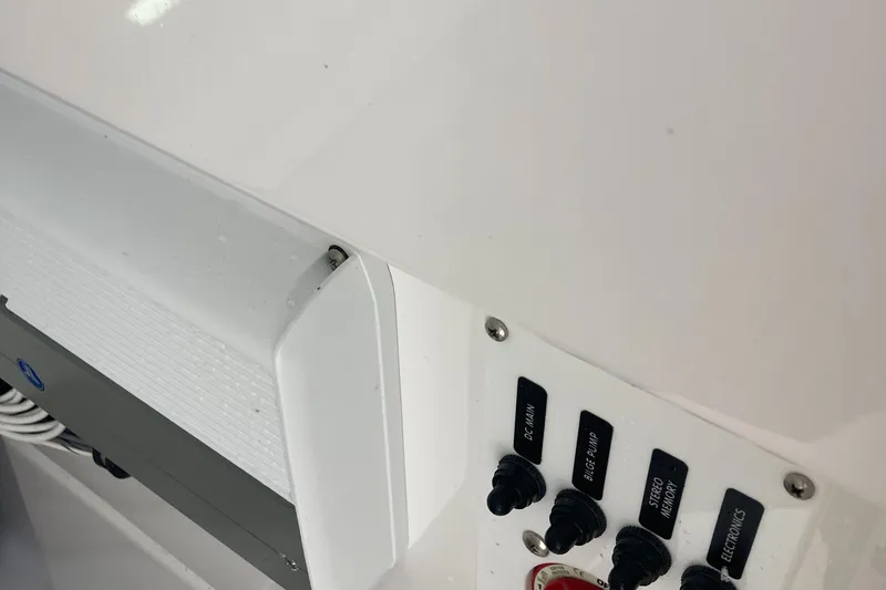 Slide: The Image of Close-up of 2022 Everglades 235 Center Console boat control panel. - 20