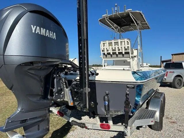 Slide: The Image of 2023 Skeeter SX241 boat with Yamaha engine on trailer, parked outdoors. - 6