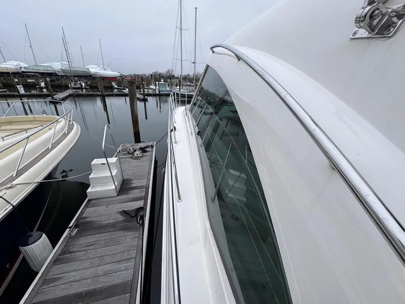 Slide: The Image of 2006 Sea Ray 48 Sundancer yacht docked at marina, side view. - 15