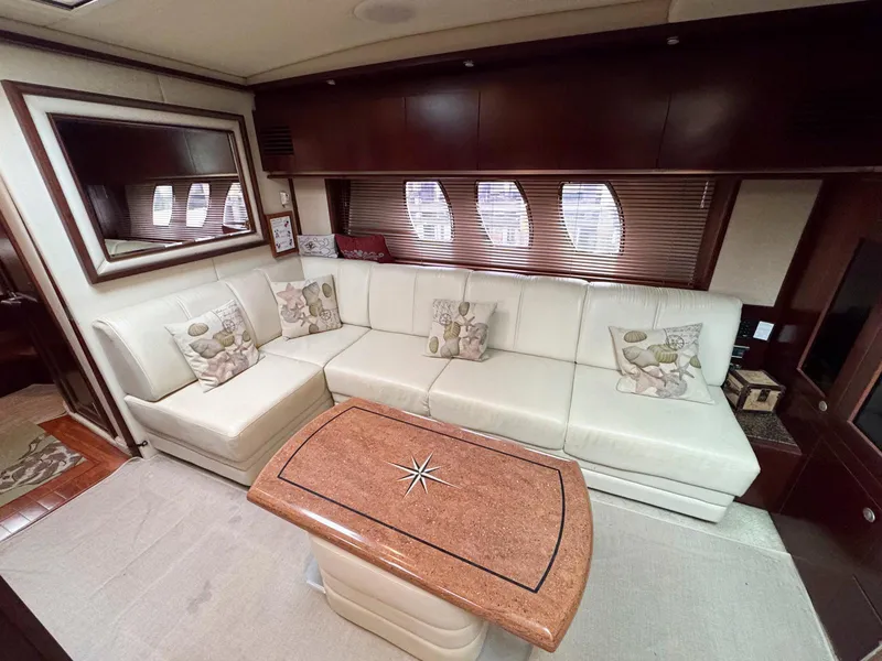 Slide: The Image of Luxurious interior of 2006 Sea Ray 48 Sundancer yacht with plush seating and elegant decor. - 19