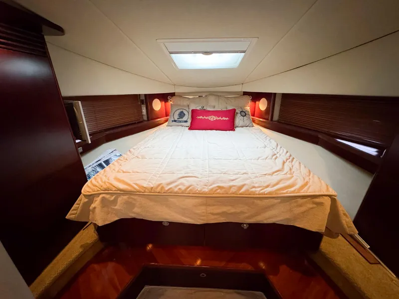 Slide: The Image of Luxurious bedroom interior of 2006 Sea Ray 48 Sundancer yacht with cozy bedding. - 20