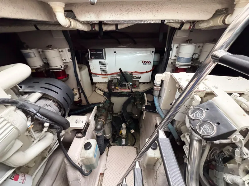 Slide: The Image of Engine room of 2006 Sea Ray 48 Sundancer with Onan generator and mechanical components. - 27