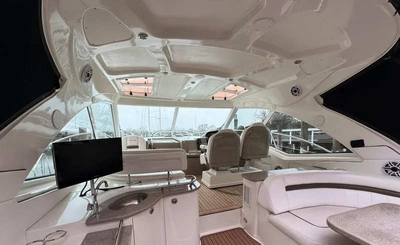 Slide: The Image of Interior of 2006 Sea Ray 48 Sundancer yacht with luxurious seating and modern amenities. - 3