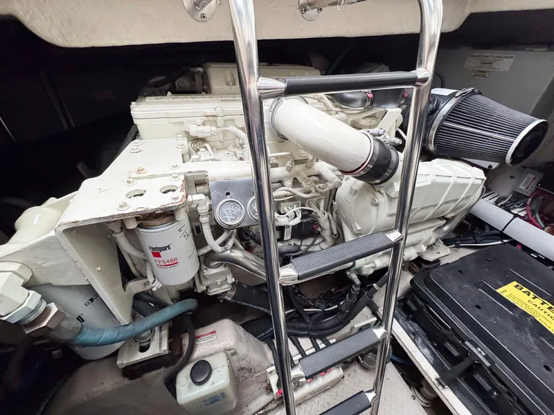 Slide: The Image of Engine compartment of 2006 Sea Ray 48 Sundancer with visible components and ladder. - 30