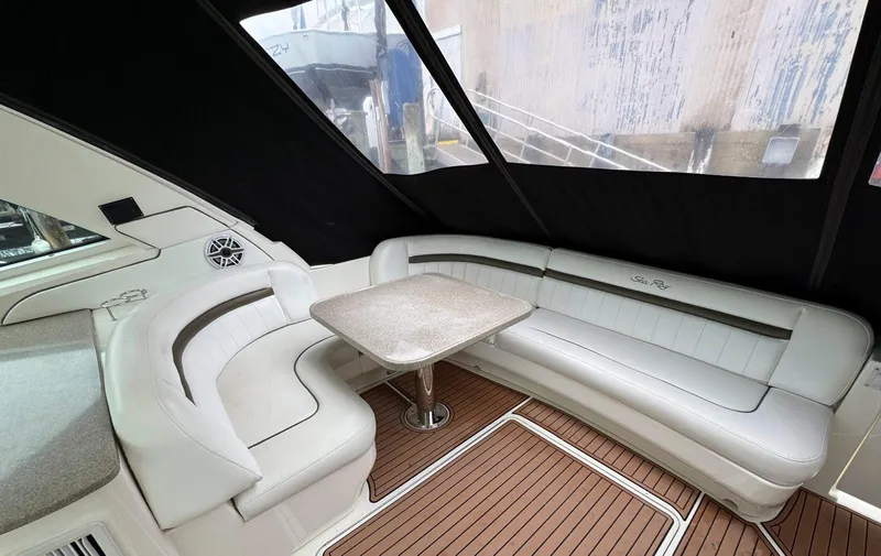 Slide: The Image of Luxurious 2006 Sea Ray 48 Sundancer yacht interior with elegant seating and table. - 8